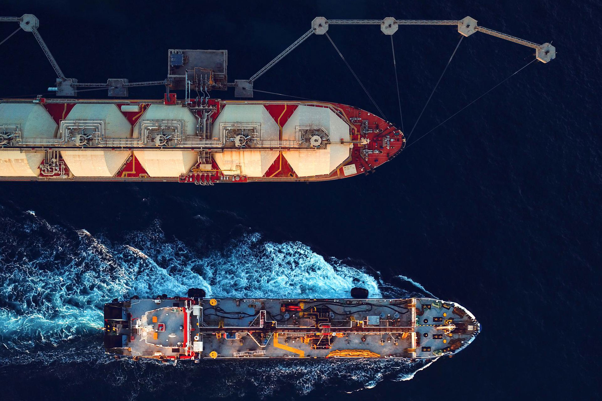 Bird's-eye view of two large cargo ships.
